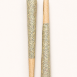 2x pre roll joints on cream background